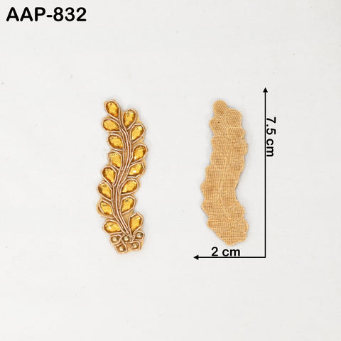 Flat lay of 25 golden Zardozi appliques with metallic gold thread and rhinestones, ideal for enhancing ethnic wear and DIY crafts. 2.5 inch (6 cm).