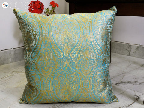 Handcrafted Banarasi brocade silk cushion cover in turquoise with gold paisley and floral patterns, decorative home accent.