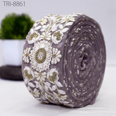 Mauve Net base fabric, white thread embroidery