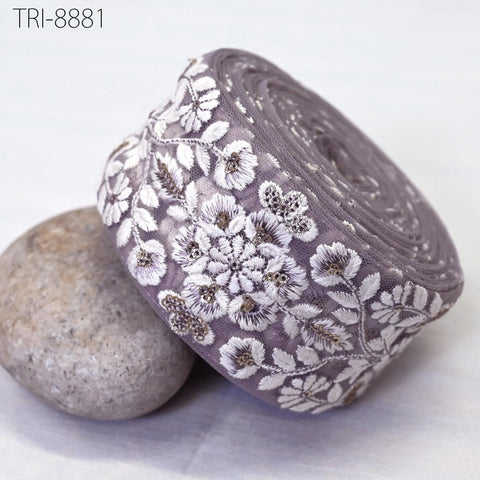 Mauve Net base fabric, white thread embroidery