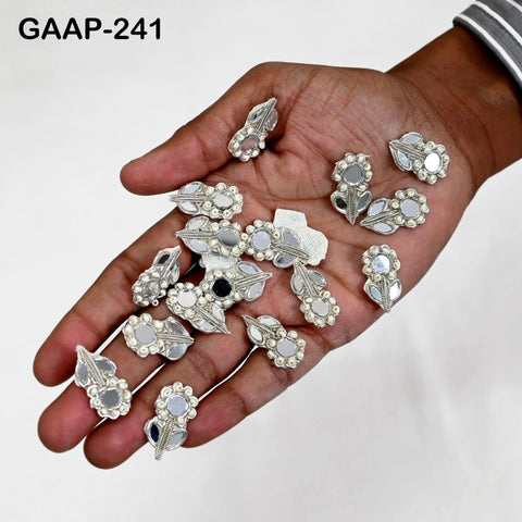 Close-up of Silver kundan mirror applique with pearls and zari thread embroidery