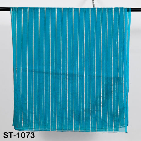 Bright turquoise blue organza dupatta with vertical metallic silver zari stripes, displayed hanging neatly for a full view of its sheer and lightweight texture