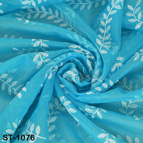 Turquoise organza dupatta with intricate white leaf embroidery, sheer and lightweight fabric perfect for Indian bridal or festive outfits.