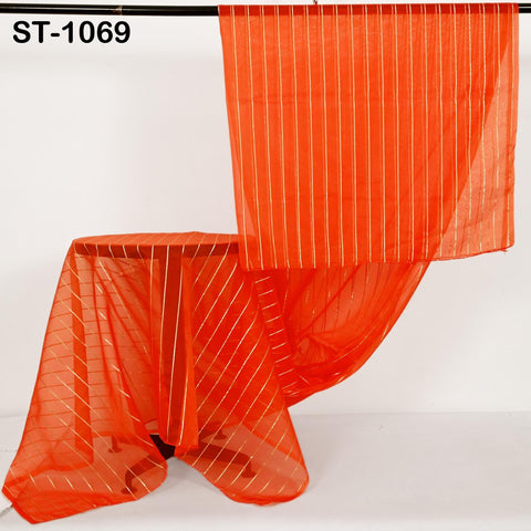 Vibrant orange organza dupatta shown on table and hanger, featuring vertical shimmering lines.