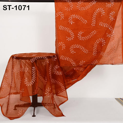 Orange organza dupatta with intricate white leaf embroidery, sheer and lightweight fabric perfect for Indian bridal or festive outfits.