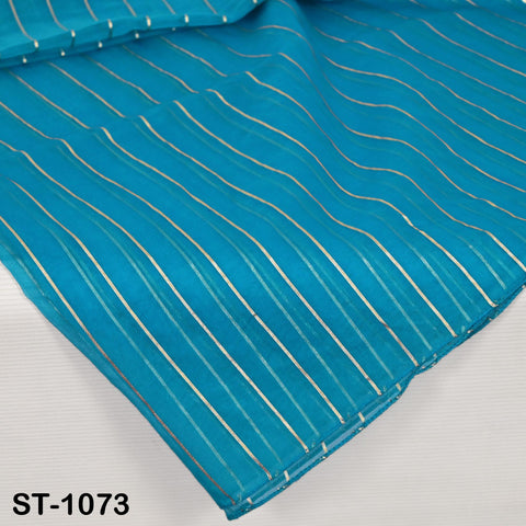 Bright turquoise blue organza dupatta with vertical metallic silver zari stripes, displayed hanging neatly for a full view of its sheer and lightweight texture