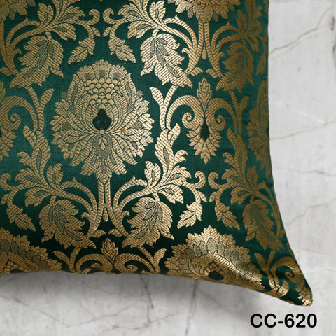 Emerald green Banarasi silk pillow cover featuring gold woven floral design.