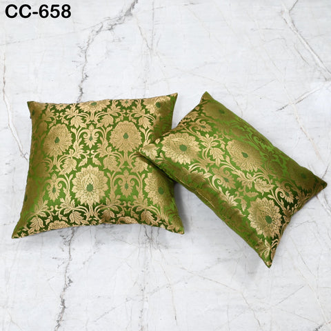 Luxury green and gold Banarasi silk rectangle pillow with intricate floral damask weaving.