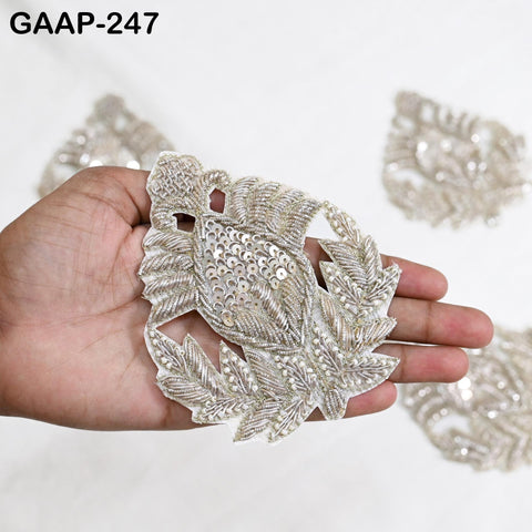 Silver Zardozi embroidery motif showing metallic thread, sequin and bead detailing on floral motif applique.