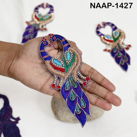 Peacock patch showing intricate gold thread, bead and sequin work with red, green silk detailing.