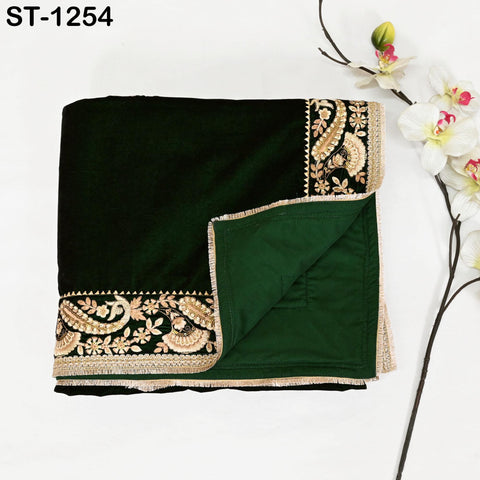 Full view of green velvet shawl draped to show fabric and border design