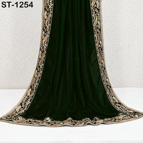Full view of green velvet shawl draped to show fabric and border design
