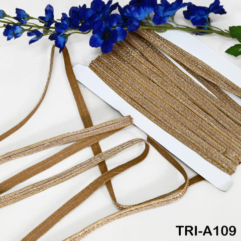 Roll of 9-yard metallic gold zari lace trim with narrow 1.5 cm width for garment and décor projects.