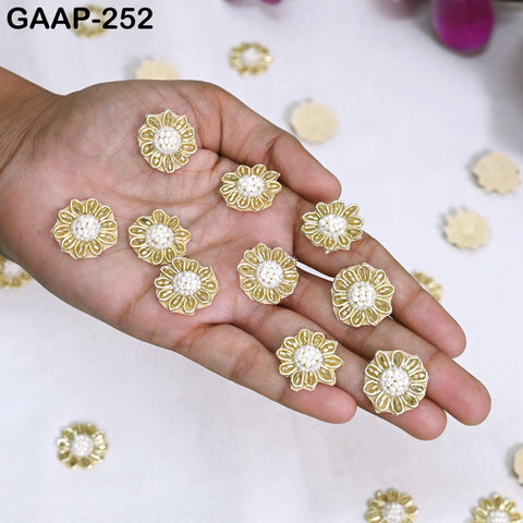 Close up of Gold Applique Crystal rhinestone beaded patch for bridal gown embellishment — handmade artisan motif