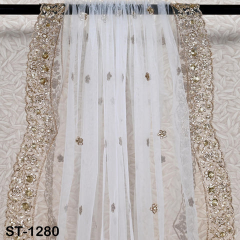 Close-up of gold zari and sequin embroidery on dyeable net dupatta.