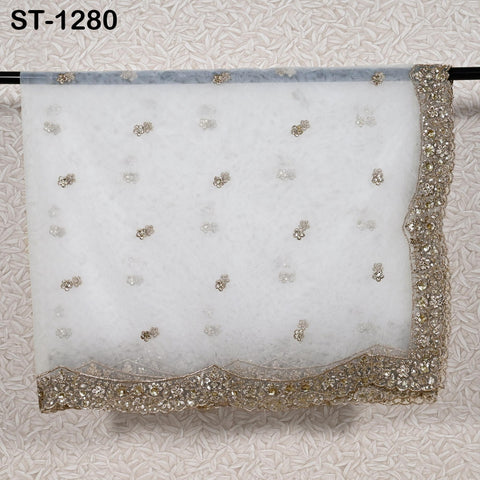 Gold embroidered dyeable net dupatta with sequin border displayed folded on Rod.