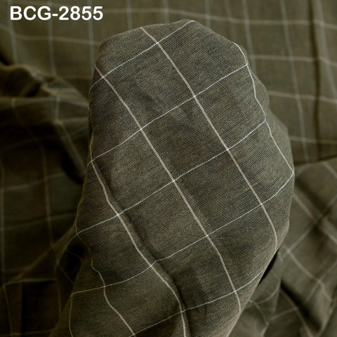 a close-up view of a fabric with a checkered pattern, featuring a diagonal grid of white lines.
