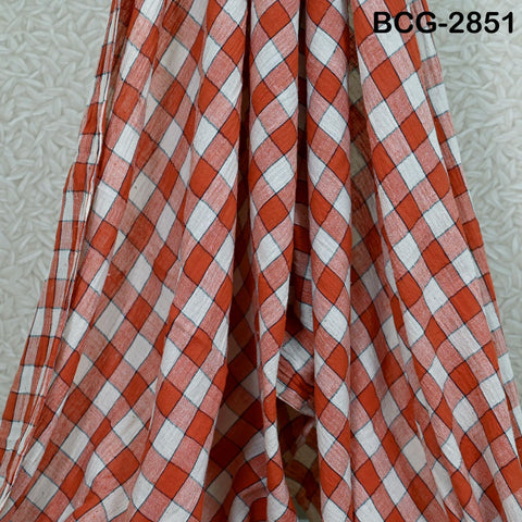 a close-up view of a fabric with a red and white checkered pattern.