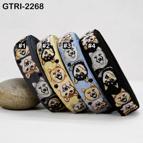 a collection of four embroidered dog-themed bracelets, each with a unique design and color.