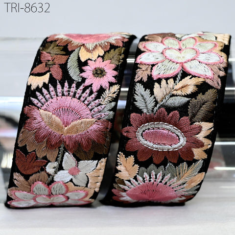 two decorative fabric pieces with intricate floral embroidery in shades of pink, white, and brown. The pieces are placed side by side, showcasing the detailed craftsmanship of the embroidery work.