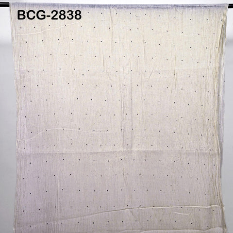 a plain white fabric with small black dots, hanging on a white background.