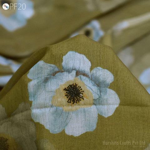 a close-up view of a fabric with a large white flower design on it.