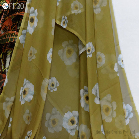 a close-up view of a fabric with a floral pattern, featuring white and yellow flowers. The fabric appears to be made of a sheer material, giving it a delicate and airy appearance.