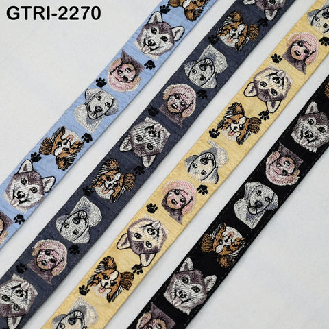 a collection of colorful fabric straps with various dog faces printed on them.