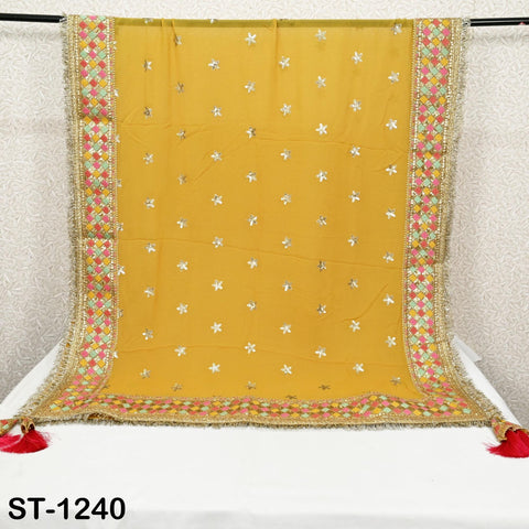 a yellow and gold embroidered sari with a floral pattern, hanging on a rack.