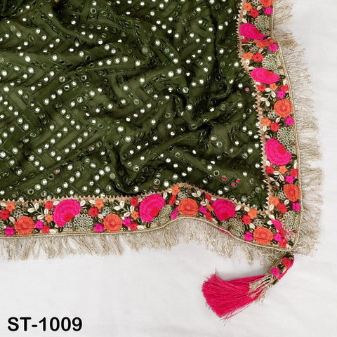 a close-up view of a decorative fabric with a floral pattern and a tassel attached to the edge.