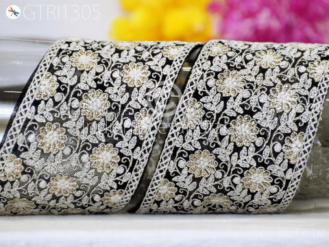 a close-up view of a decorative fabric with a floral pattern, showcasing intricate details and textures.
