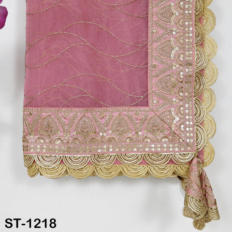 a pink and gold decorative fabric with intricate embroidery and sequin details. The fabric appears to be a traditional Indian garment, possibly a sari or a shawl. The image is focused on the details and patterns of the fabric, without describing each individual element.