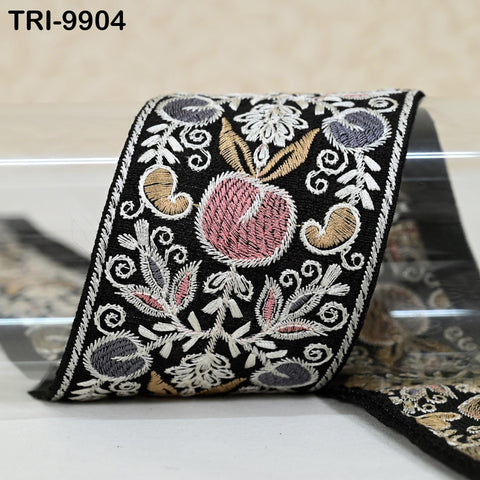 a decorative fabric with a floral pattern in black, white, and pink colors.