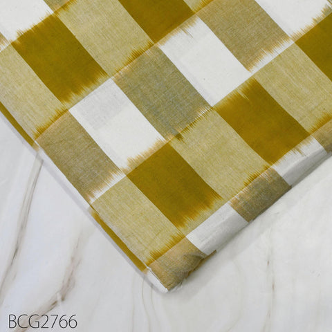 a close-up view of a fabric with a yellow and white checkered pattern, resting on a marble surface.