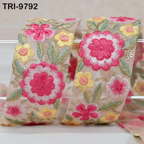 two pieces of fabric with a floral pattern, featuring pink and yellow flowers and green leaves. The text "TRI-9592" is visible in the image.