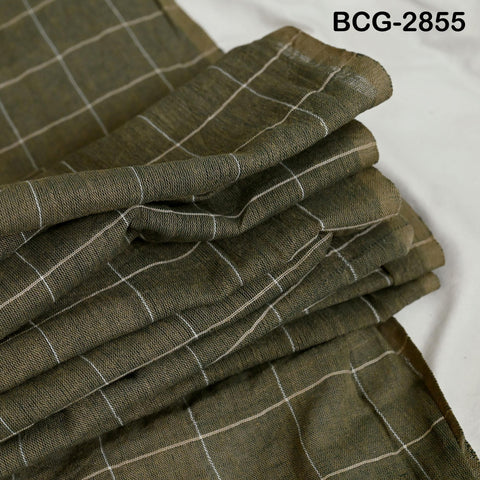A close-up image of a fabric with a checkered pattern in shades of green and white.