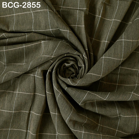 a close-up view of a fabric with a grid pattern, featuring a mix of dark and light green colors.