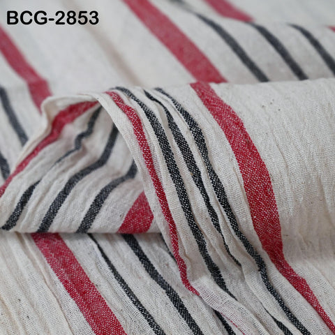a close-up view of a fabric with a striped pattern in red, black, and white.