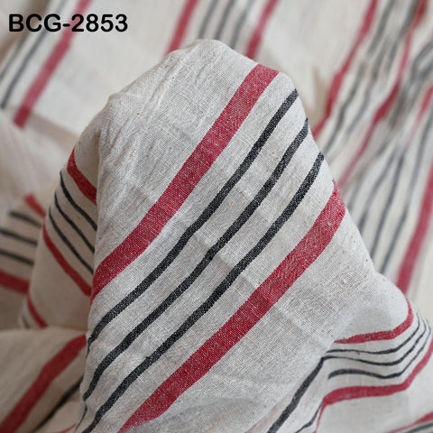 a close-up view of a fabric with horizontal stripes in red, black, and white. The fabric appears to be made of a soft, textured material.