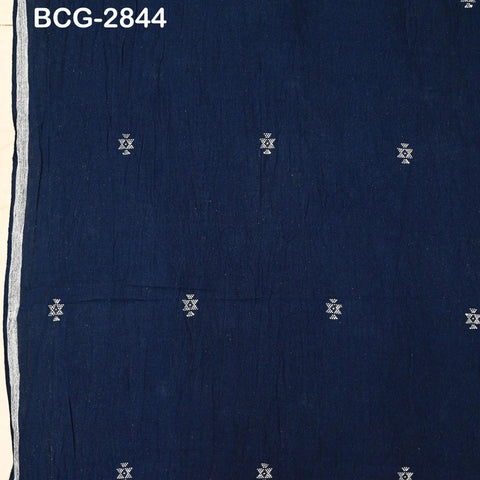 The image is a close-up of a dark blue fabric with small white geometric patterns or designs scattered across it.