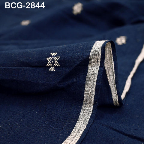 a close-up view of a dark blue fabric with a white pattern or design on it.