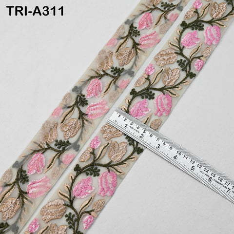 a pair of decorative fabric pieces with a floral pattern, featuring pink and green flowers and leaves. A ruler is placed on top of the fabric, indicating the size of the fabric.