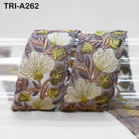 two pieces of fabric with a floral pattern, featuring white and brown flowers and leaves. The text "TRI-A262" is visible in the image.