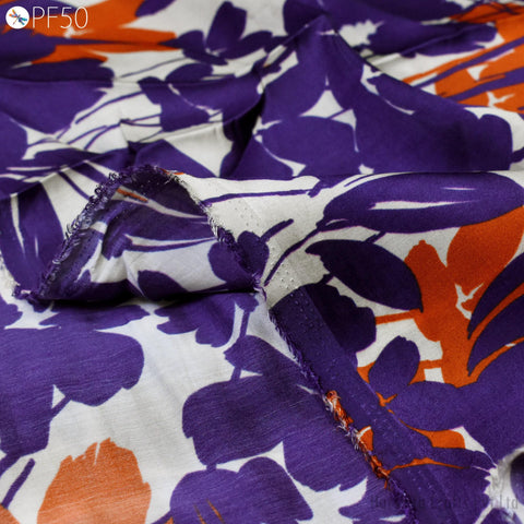 a close-up view of a fabric with a vibrant floral pattern in shades of purple and orange.