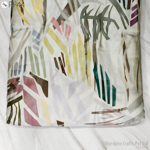 The image is a close-up of a colorful, abstract printed fabric with various geometric shapes and patterns.