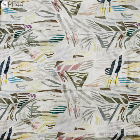 The image is a collage of abstract geometric patterns in various colors and shapes, creating a visually striking and dynamic composition.