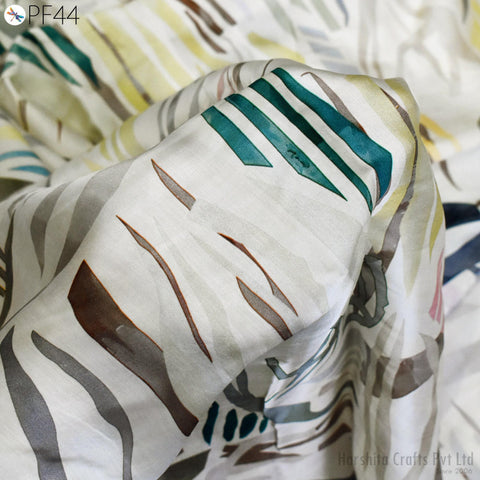 a close-up view of a fabric with a zebra print pattern. The fabric appears to be white with green and brown stripes, creating a visually striking design.