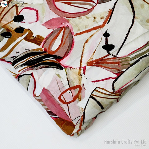 a close-up view of a colorful, abstract fabric with various shapes and patterns, including circles, lines, and splashes of color.