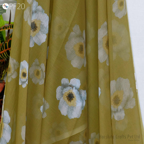 a close-up view of a fabric with a floral pattern, featuring white and yellow flowers. The fabric appears to be made of a sheer material, giving it a delicate and airy appearance.