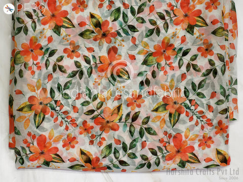 a fabric with a floral pattern of orange flowers and green leaves.